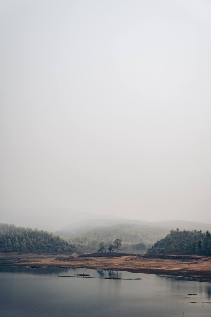 Foggy valley with layered peaks